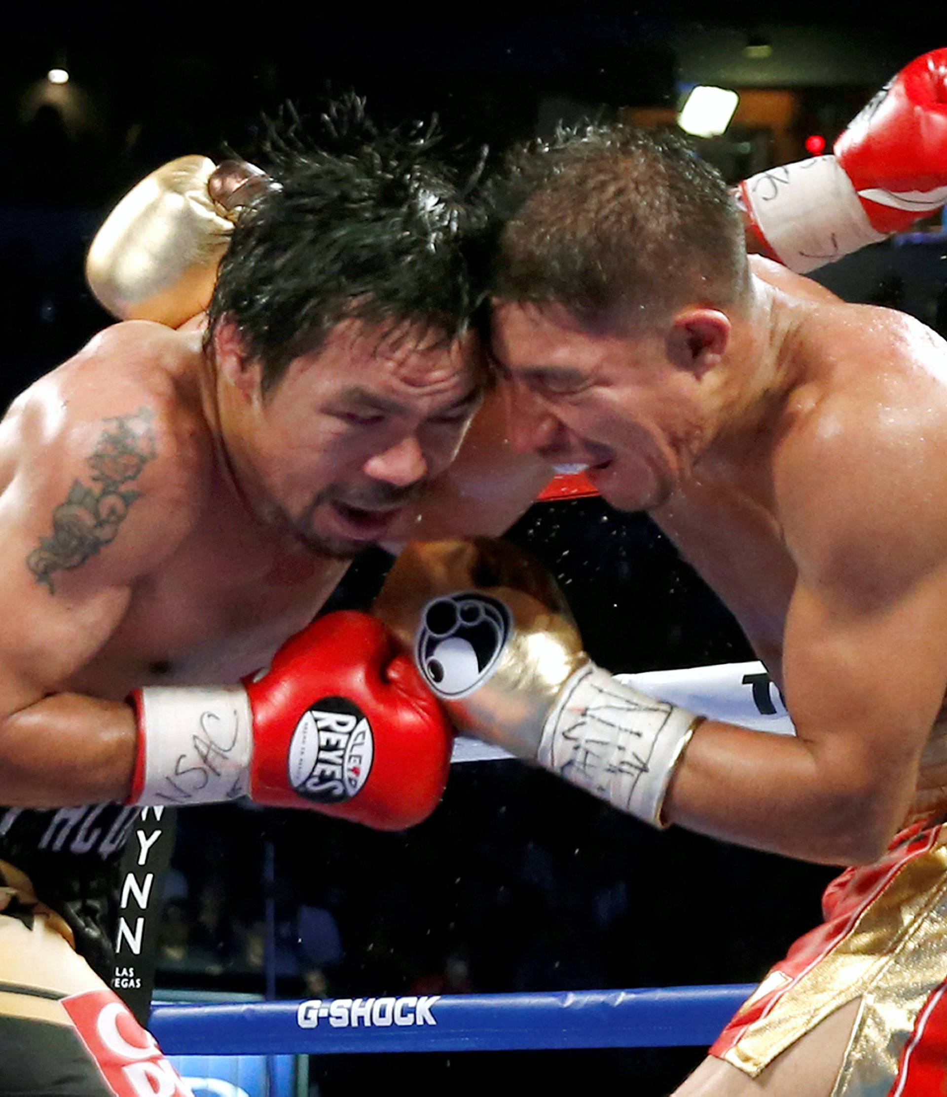 Pacquiao and Vargas butt heads during their title fight at the Thomas & Mack Center in Las Vegas