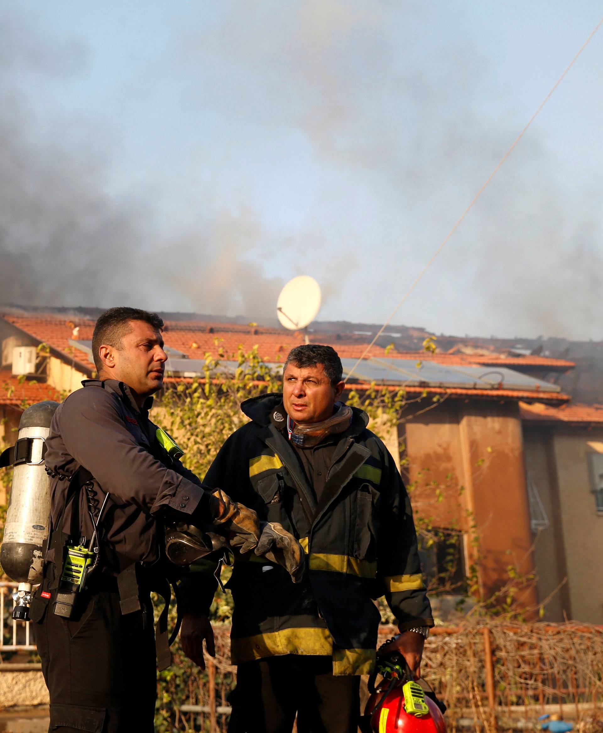 Firefighters work as a wildfire burns in the northern city of Haifa, Israel 