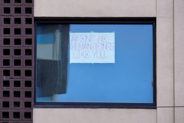 A sign at the hotel where tennis player Novak Djokovic is believed to be in Melbourne