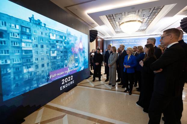 Ukrainian President Zelenskiy and EU leaders watch a video presentation before a meeting of 'Coalition of the Willing' in Kyiv