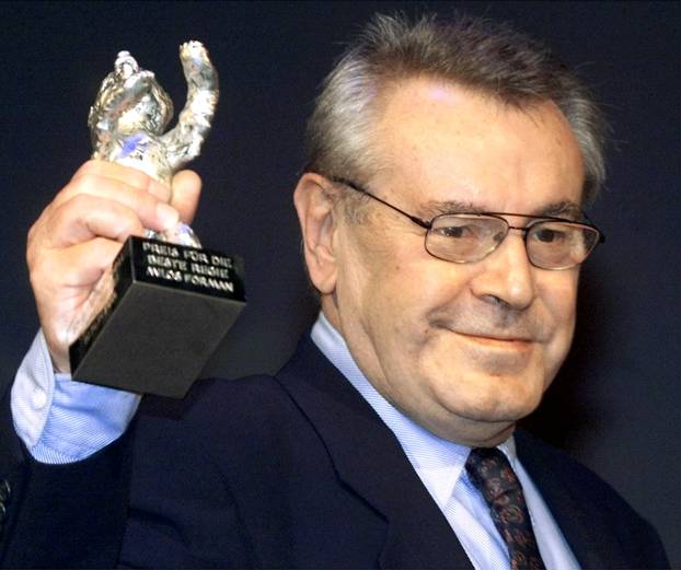 FILE PHOTO: Czech director Milos Forman holds up the Silver Bear Prize during the awarding ceremony at the 50th Berlin Film Festival in Berlin