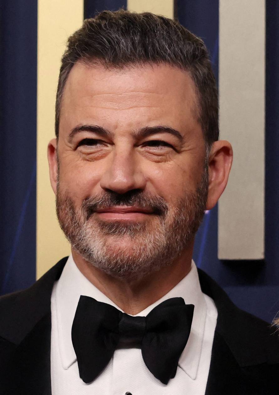 FILE PHOTO: Jimmy Kimmel poses on the red carpet at the 77th Primetime Emmy Awards in Los Angeles