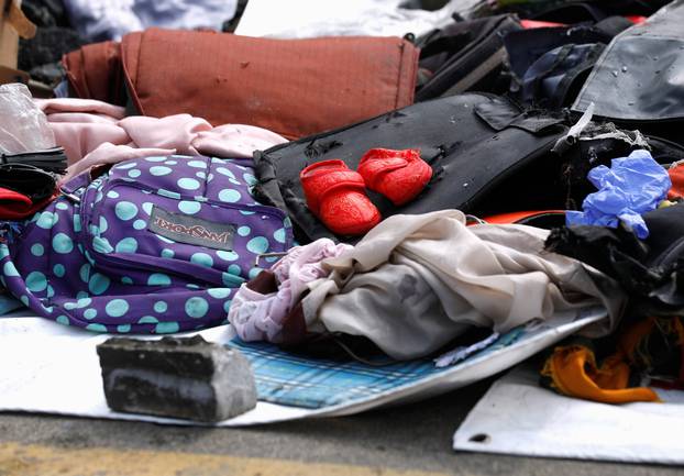 A pair of infant shoes is pictured among recovered belongings believed to be from the crashed Lion Air flight JT610 at Tanjung Priok port in Jakarta