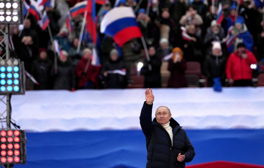 Russian President Vladimir Putin attends a concert marking the eighth anniversary of Russia's annexation of Crimea in Moscow