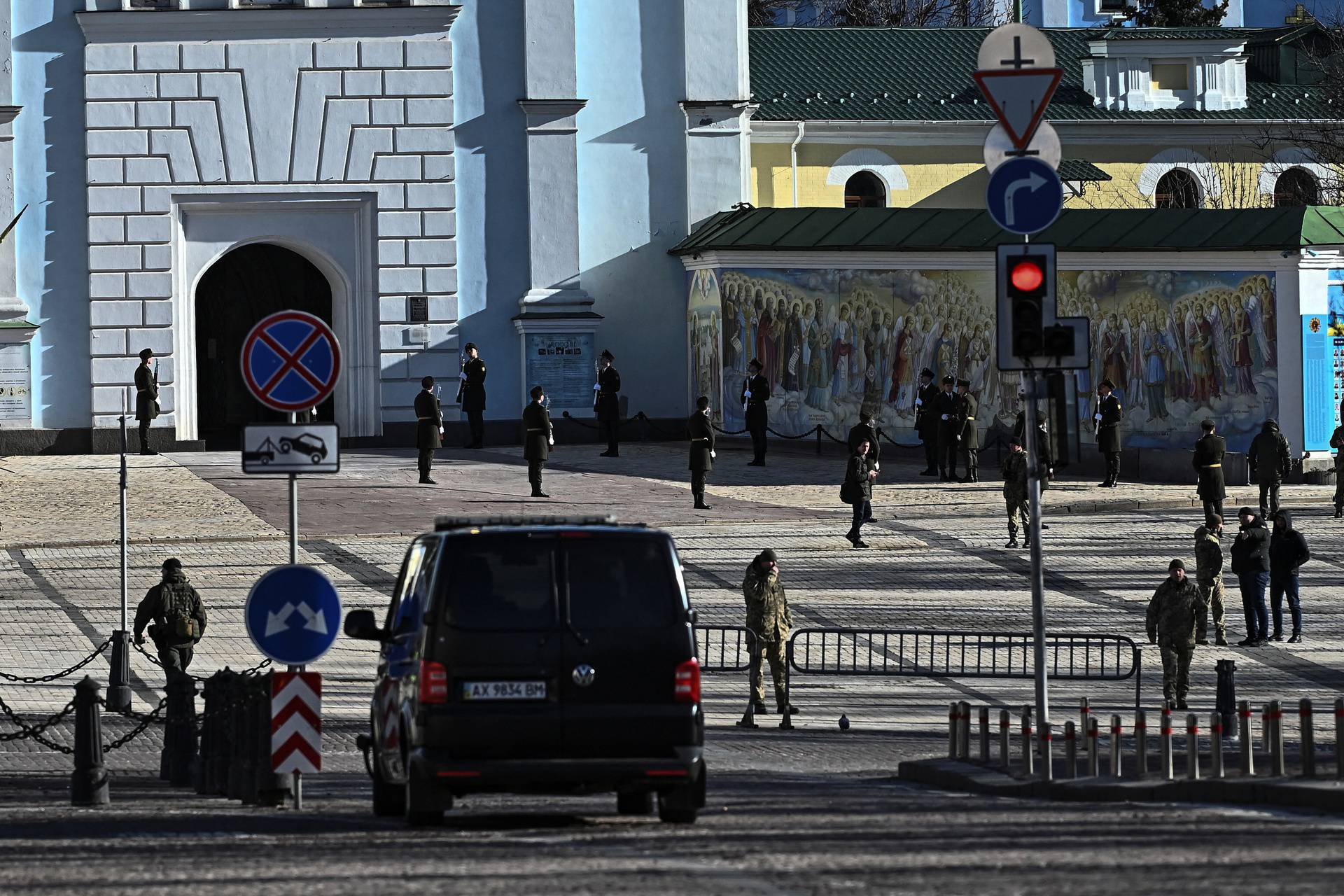 Members of the Honour Guard stand next to the Saint Michael's cathedral in Kyiv