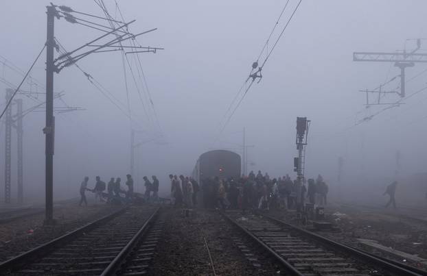 Railway tracks amidst heavy fog on a cold winter morning in New Delhi