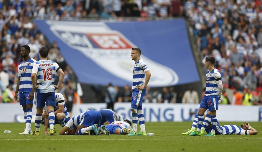 Reading players look dejected after losing the penalty shootout