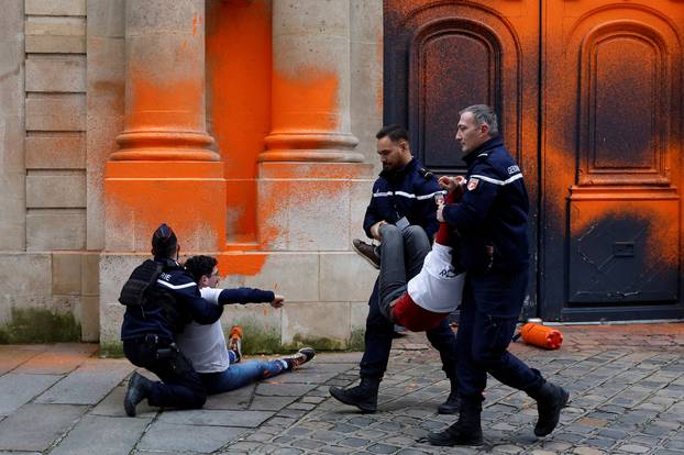 Environmental activists of "Derniere Renovation" spray paint on the Hotel Matignon in Paris