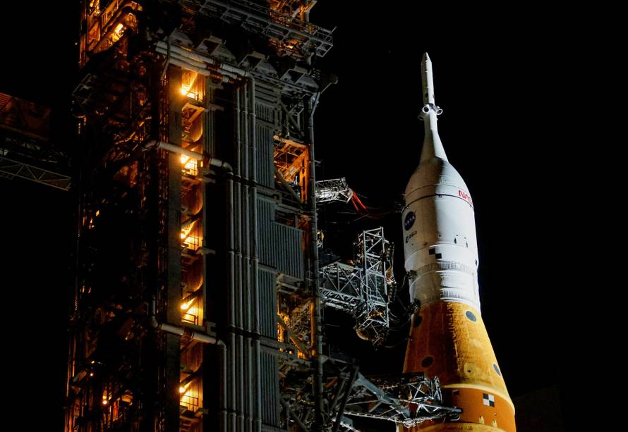 NASA's next-generation moon rocket, the Space Launch System (SLS) rocket with the Orion crew capsule, rolls again to Pad 39B for launch