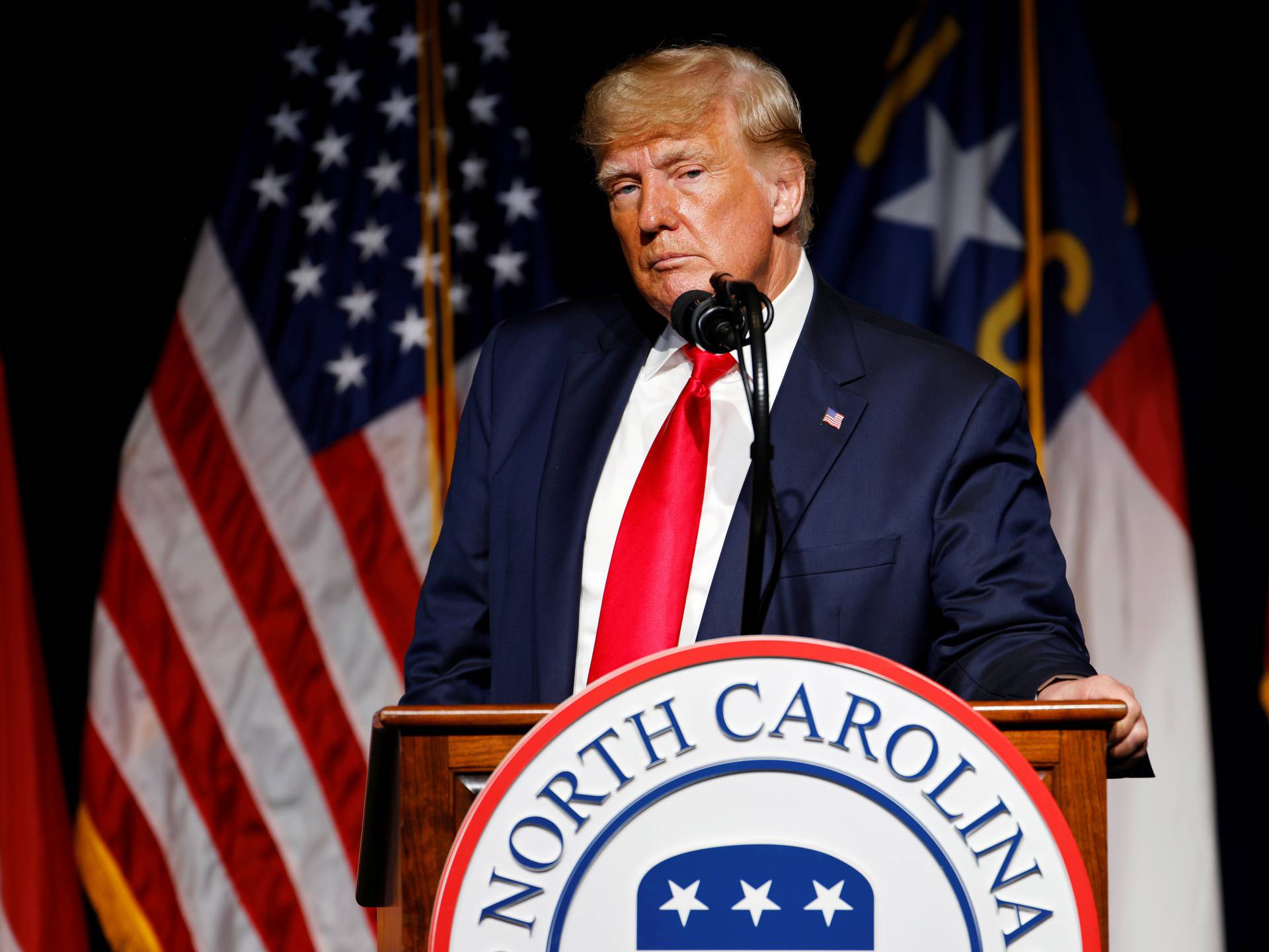 Former U.S. President Donald Trump pauses while speaking at the North Carolina GOP convention dinner in Greenville