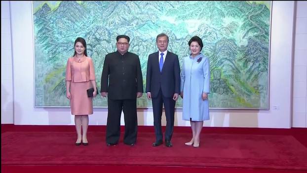 North Korean leader Kim Jong Un and first lady Ri Sol Ju, South Korean President Moon Jae-in and first lady Kim Jung-sook pose for photos during the inter-Korean summit at the truce village of Panmunjom