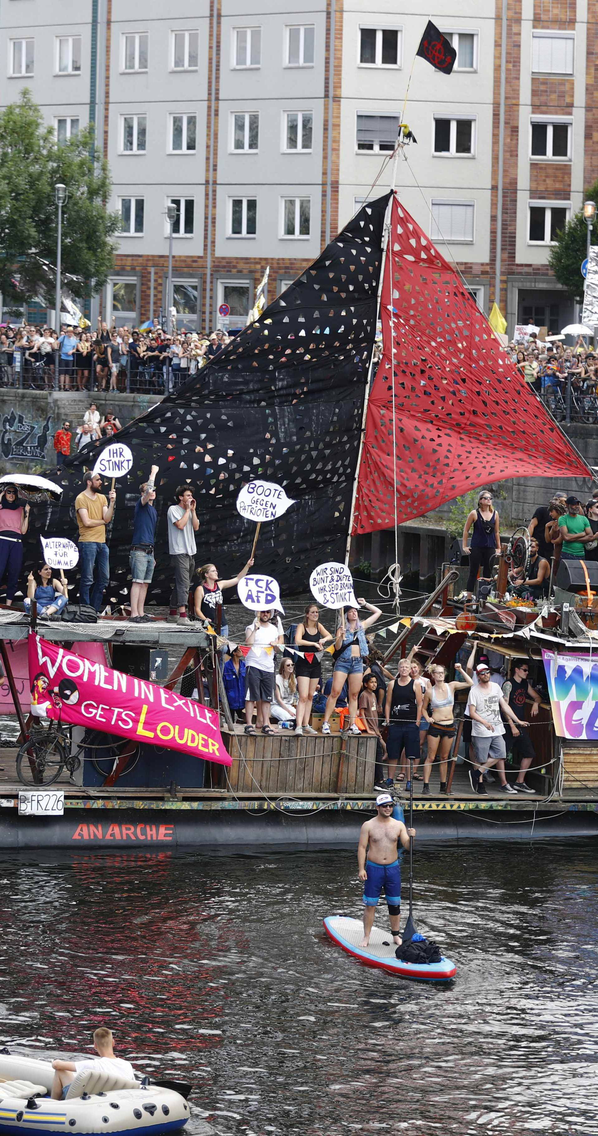 People stage a protest against Anti-immigration party Alternative for Germany (AfD) demonstration in Berlin