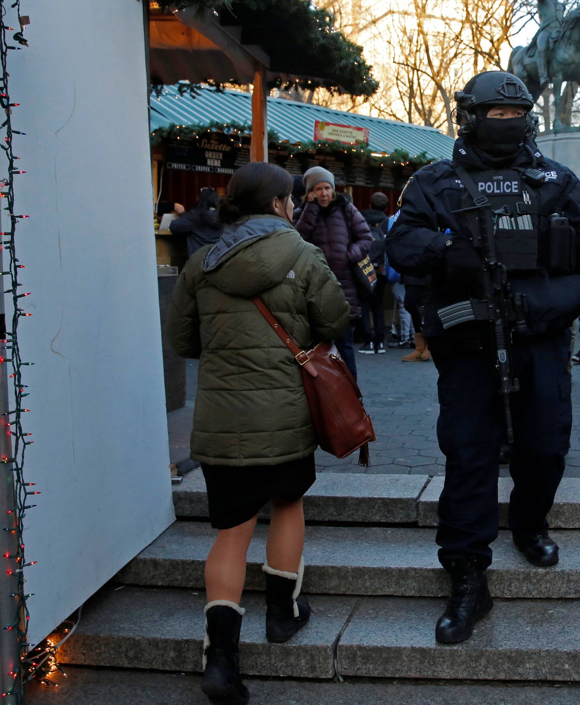 A member of the New York Police Department's Counterterrorism Bureau patrols the Union Square Holiday market following the Berlin Christmas market attacks in Manhattan, New York City, U.S.