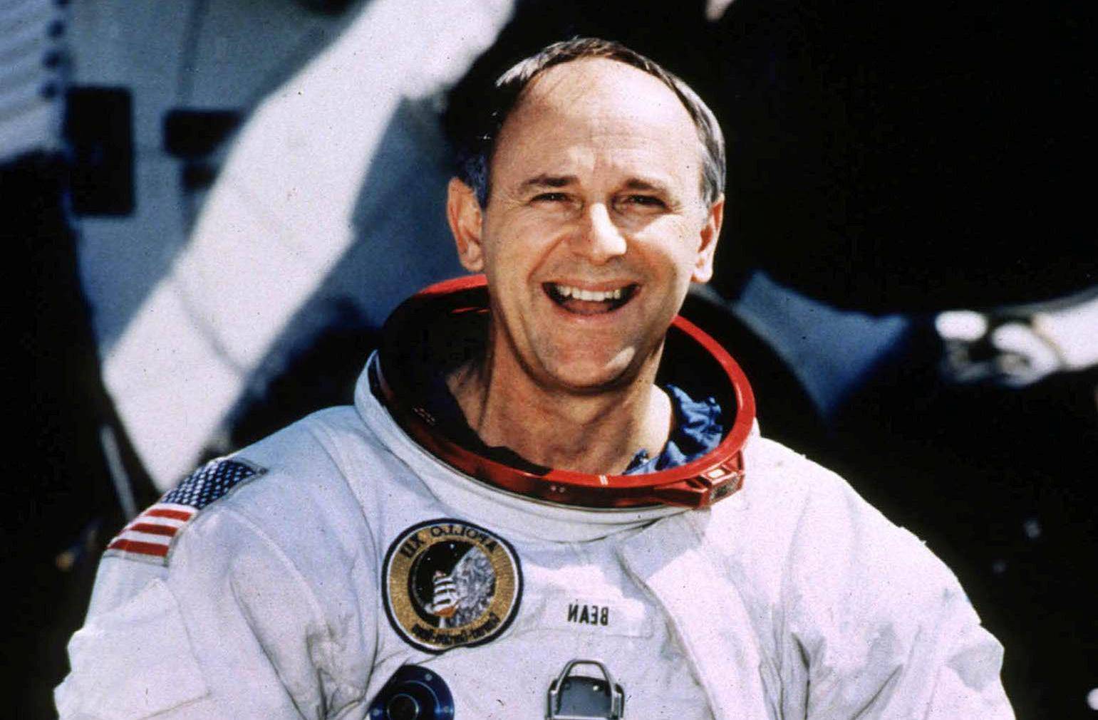 FILE PHOTO: Retired Astronaut Bean, 66, poses for a portrait in his spacesuit at the Johnson Space Center in Houston