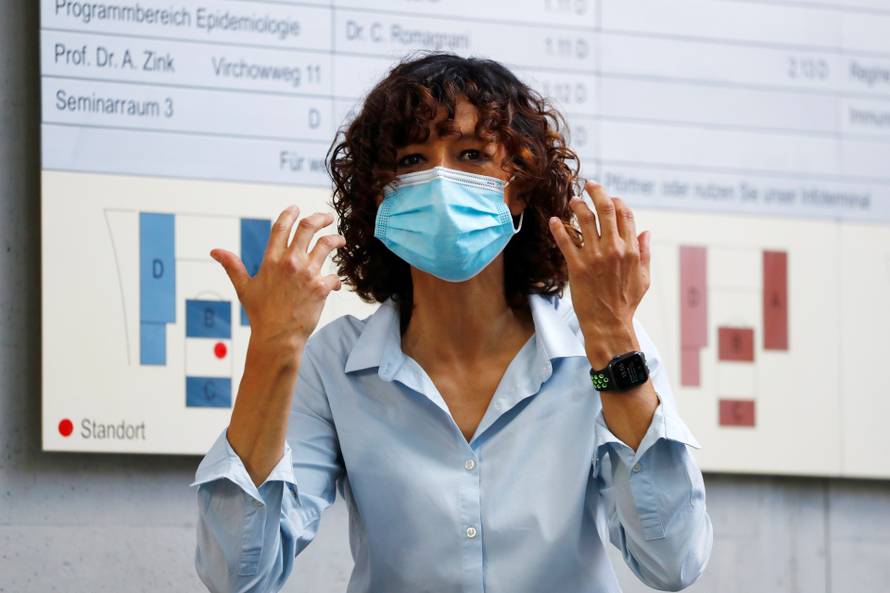 Scientist Emmanuelle Charpentier, director of the Max Planck Institute for Infection Biology in Berlin puts on a protective face mask, after winning the 2020 Nobel Prize in Chemistry for the development of a method for genome editing, in Berlin