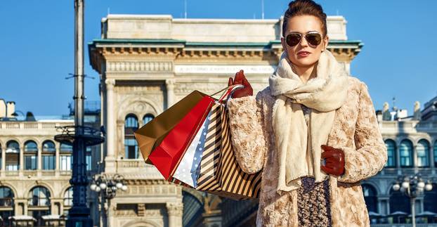 modern traveller woman in Milan, Italy standing