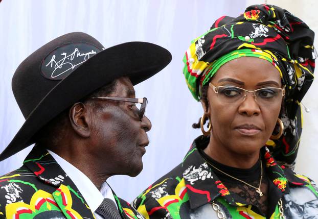 FILE PHOTO: FILE PHOTO: President Robert Mugabe and his wife Grace attend a rally of his ruling ZANU (PF) in Chinhoyi