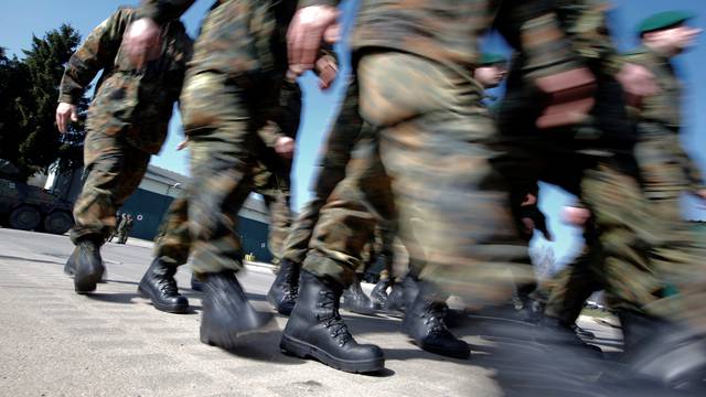 FILE PHOTO: German Bundeswehr armed forces soldiers of the 371st armoured infantry battalion march during a media day of the NATO drill 'NOBLE JUMP 2015' at the barracks in Marienberg