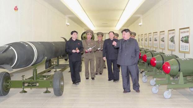 North Korean leader Kim Jong Un inspects nuclear warheads at an undisclosed location