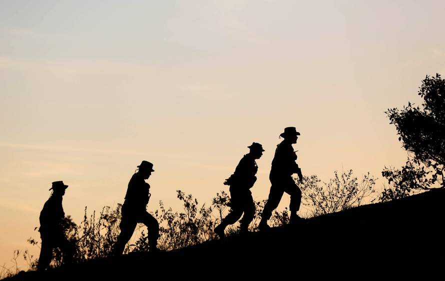 Venezuelan soldiers patrol along the border between Venezuela and Brazil in Pacaraima