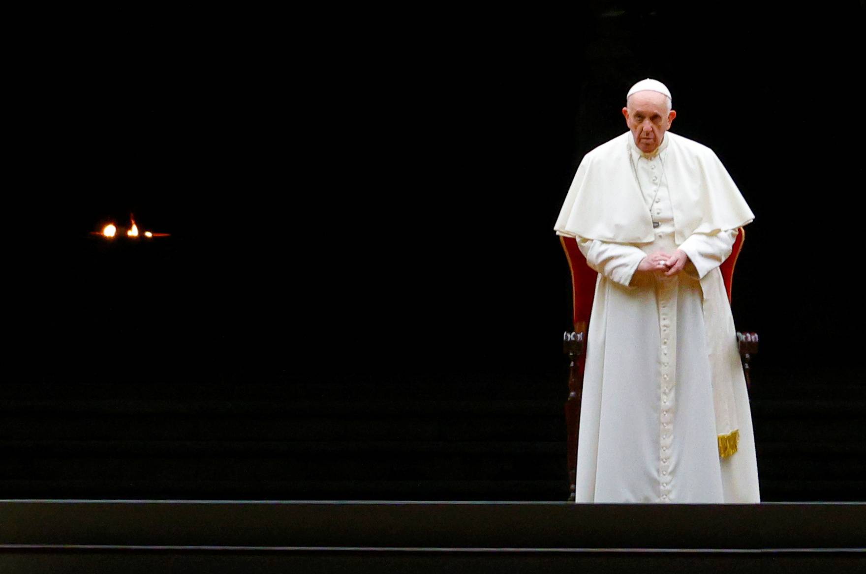 Pope Francis leads the Via Crucis (Way of the Cross) procession during Good Friday celebrations at the Vatican