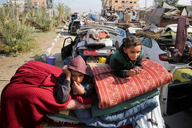 Displaced Palestinians wait to be allowed to return to their homes in northern Gaza, in the central Gaza Strip