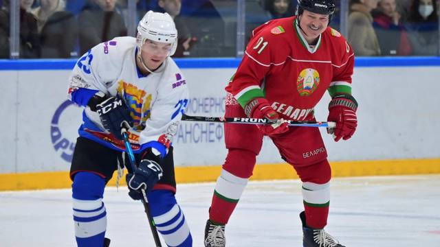 Belarusian President Alexander Lukashenko takes part in a hockey match