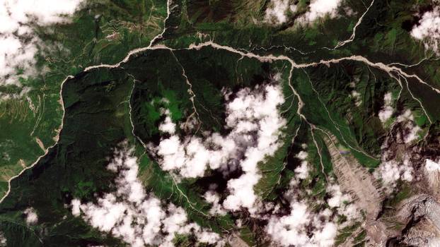 Satellite images show torrent of rock and ice high in Nepalese mountain valley after Nepal-China disaster