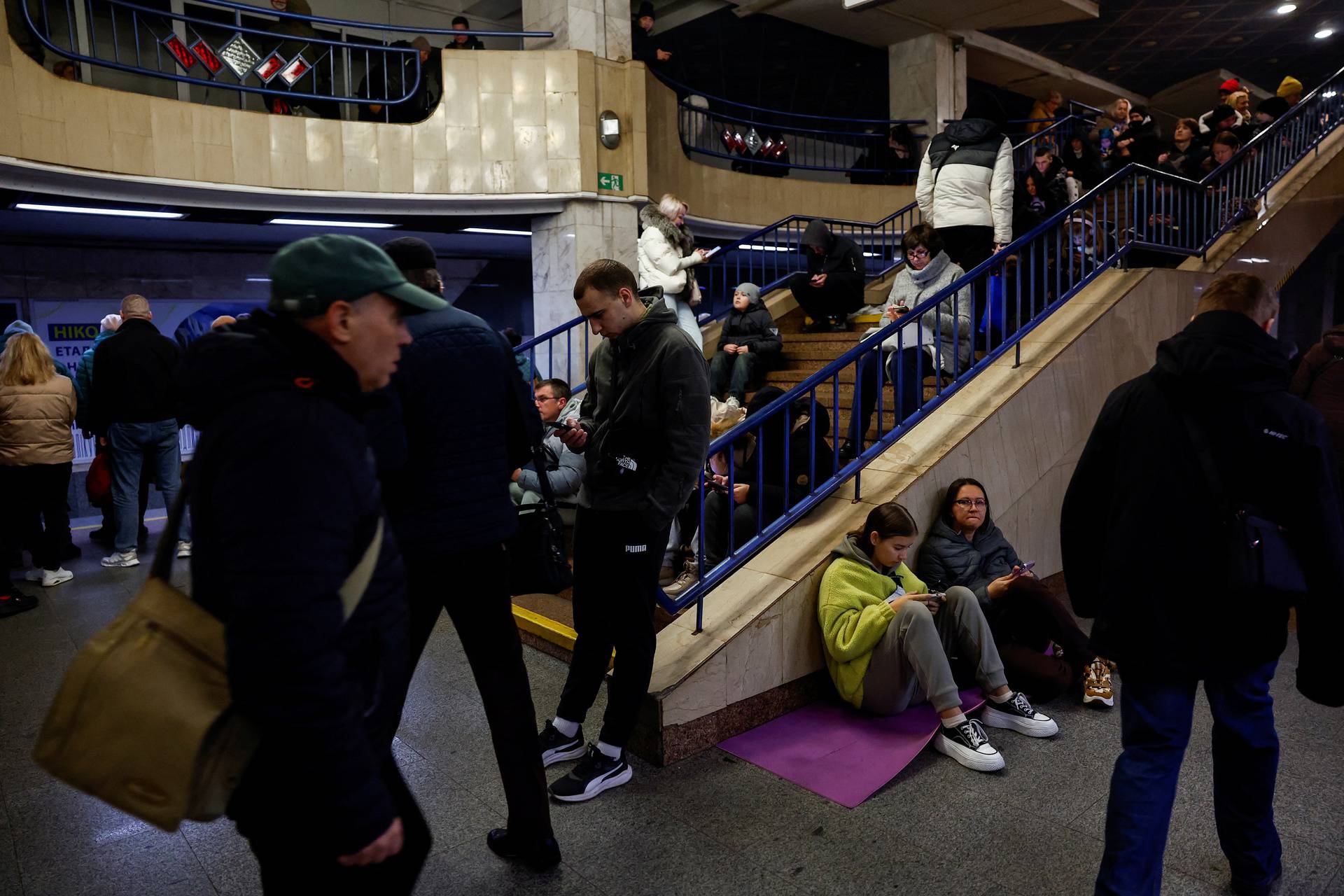 People take shelter during a Russian missile and drone attack, in Kyiv