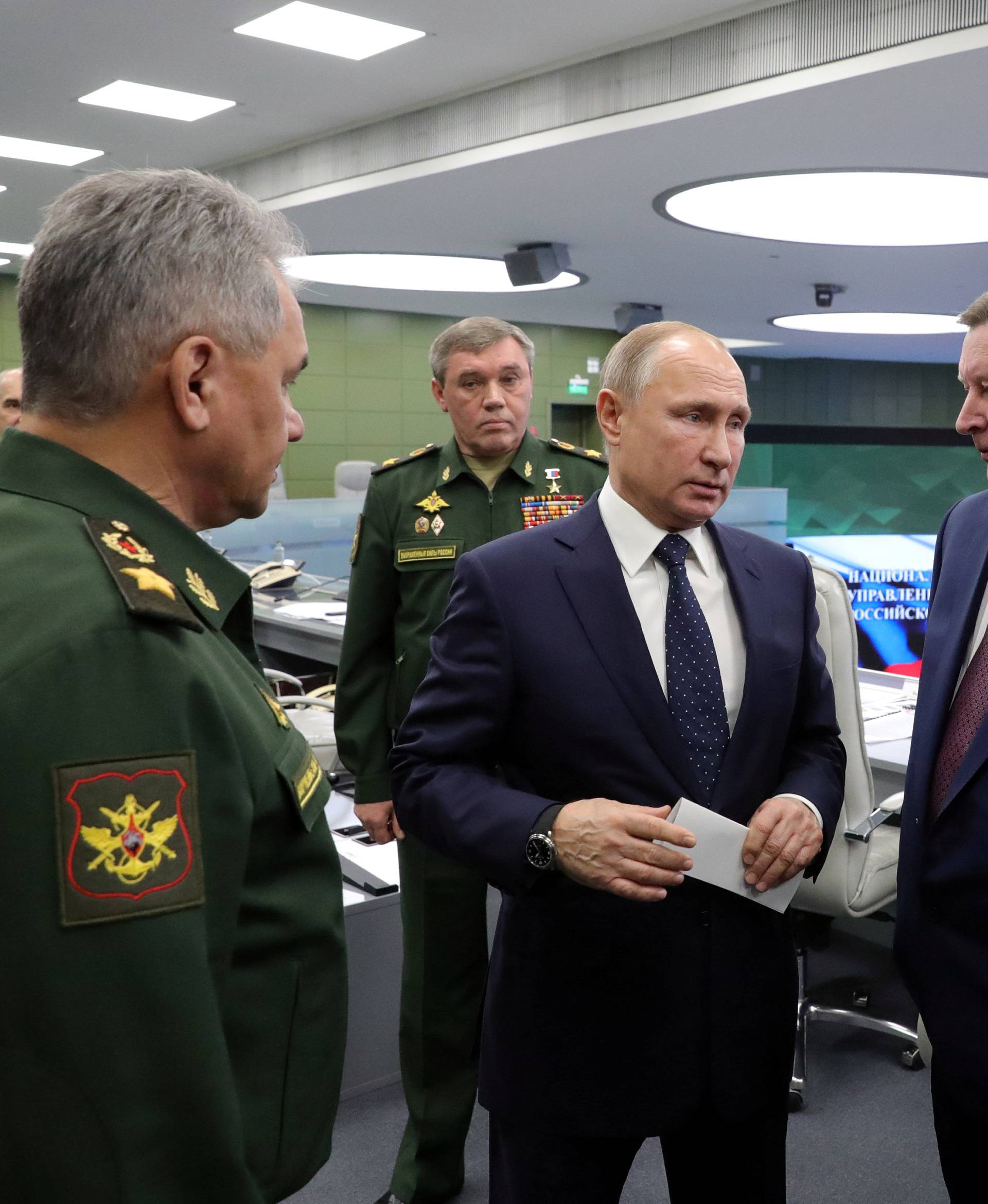 Russian President Vladimir Putin visits the National Defence Control Centre in Moscow