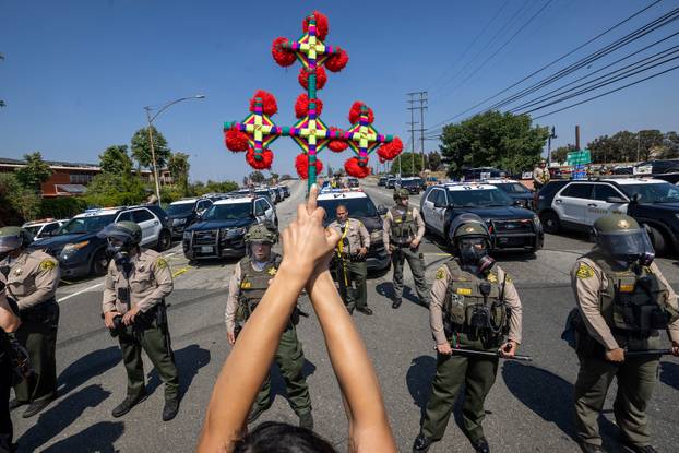 Standoff by protesters and law enforcement, following multiple detentions by ICE in Los Angeles County