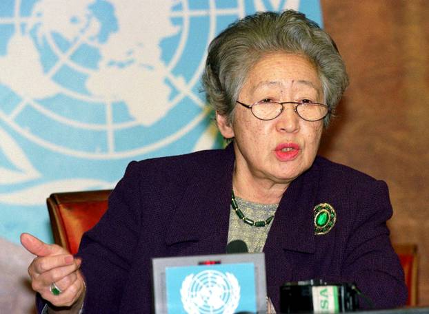 FILE PHOTO:  United Nations High Commissioner for Refugees Sadako Ogata gestures during a news conference in Geneva