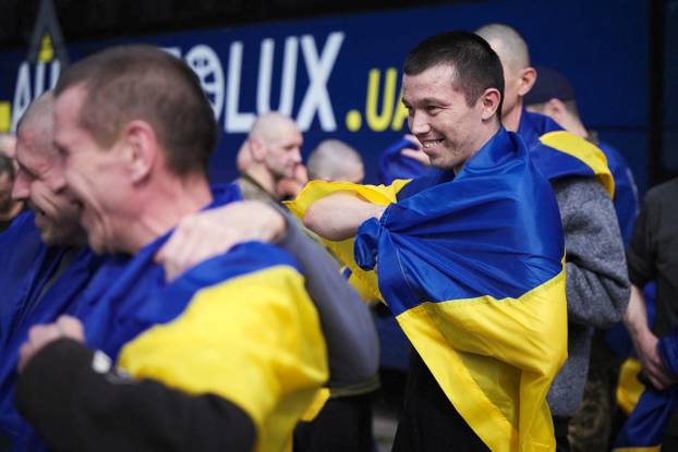 Ukrainian POWs are seen after a swap at an unknown location in Ukraine