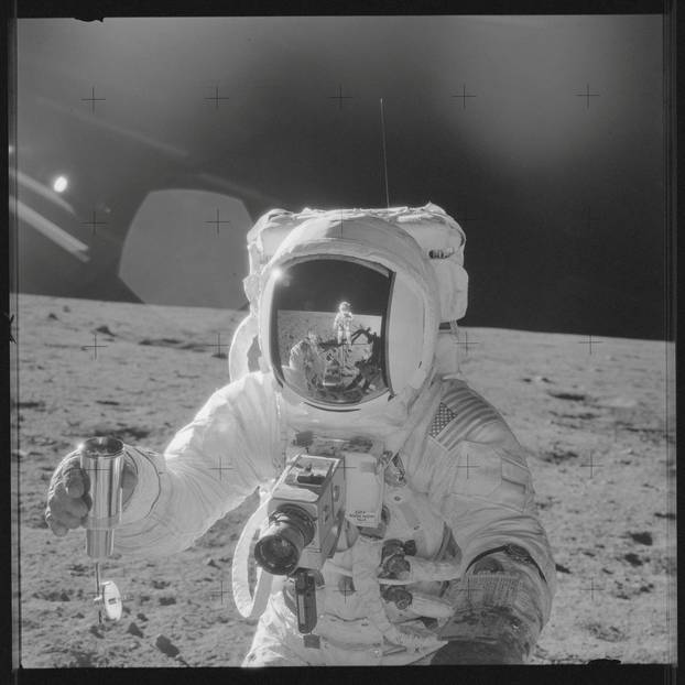 FILE PHOTO: Astronaut Alan L. Bean holds a Special Environmental Sample Container filled with lunar soil collected during the Apollo 12 mission in this NASA handout photo