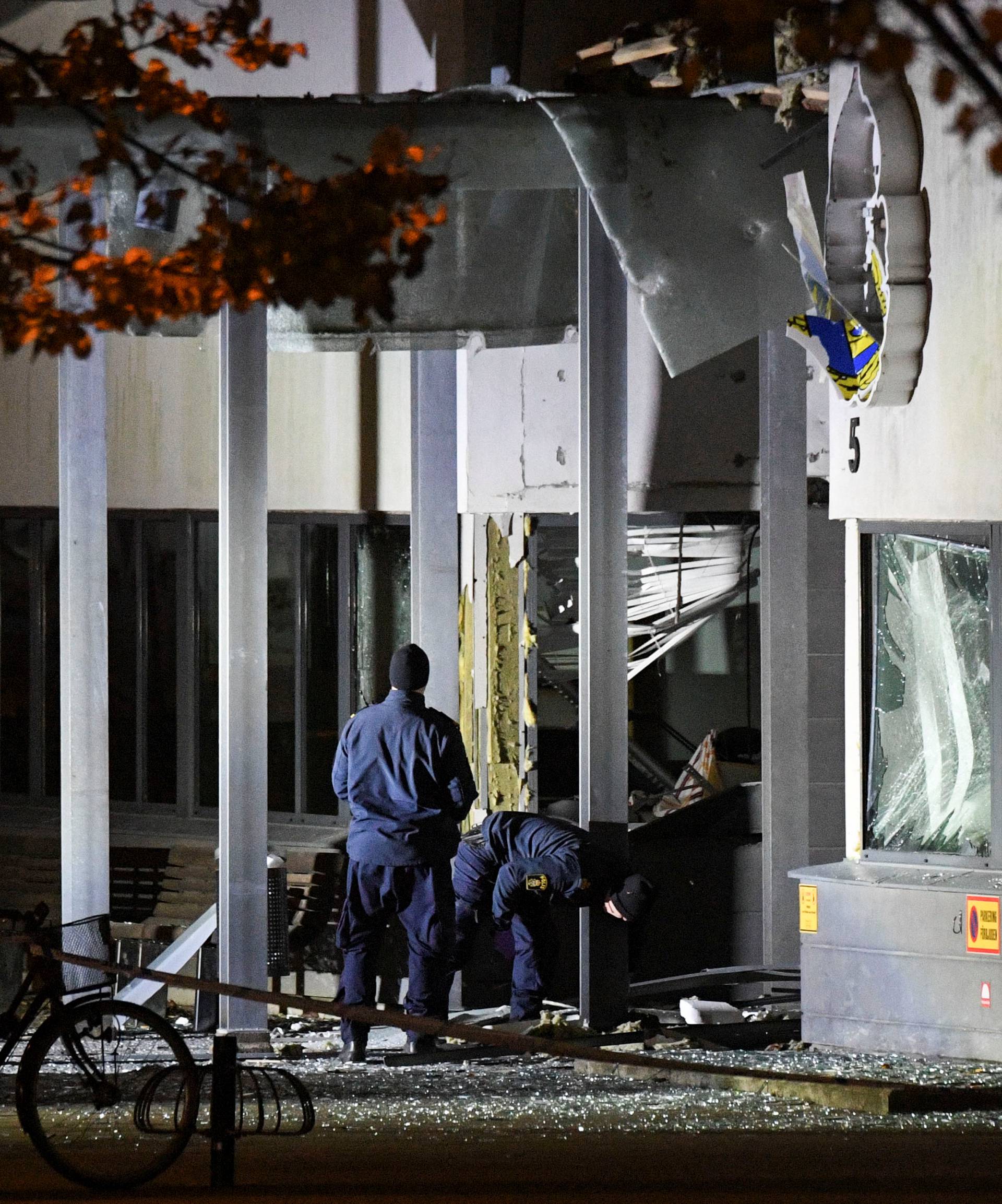 Police forensics work at the scene after a powerful explosion at the main entrance to the police station in Helsingborg