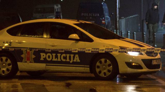 Police guard the entrance to the United States embassy building in Podgorica