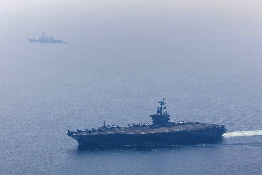 USS Abraham Lincoln carrier strike group conducts photo exercise in the Arabia Sea