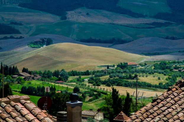 Old house roof and beautiful panorama. Tuscany, Italy.