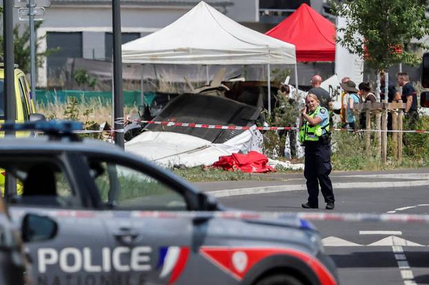 French rescuers work at the site of a plane crash, in Tomblaine