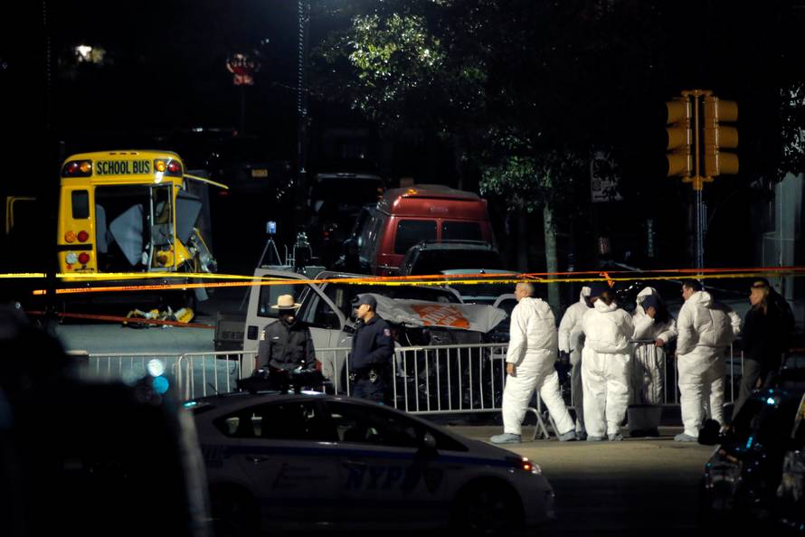Police investigate the scene of a pickup truck attack on the West Side Highway in Manhattan, New York