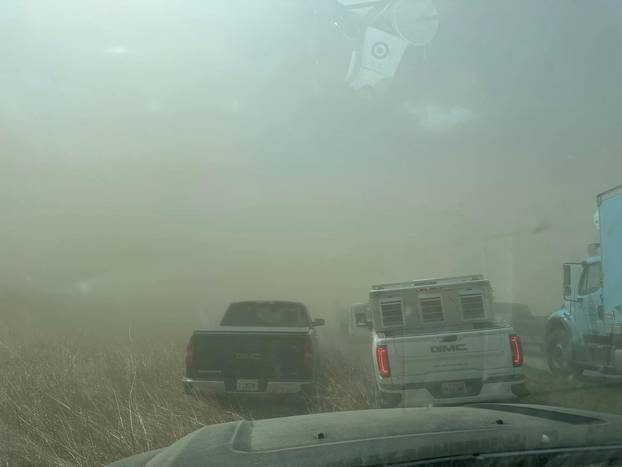 A view of vehicles in a dust storm