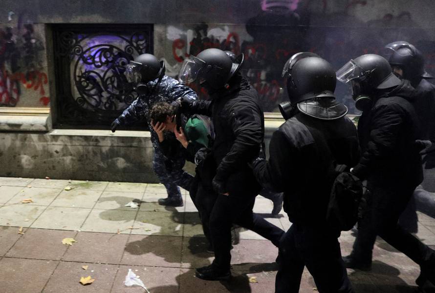 Georgian opposition supporters protest against government's EU application delay, in Tbilisi