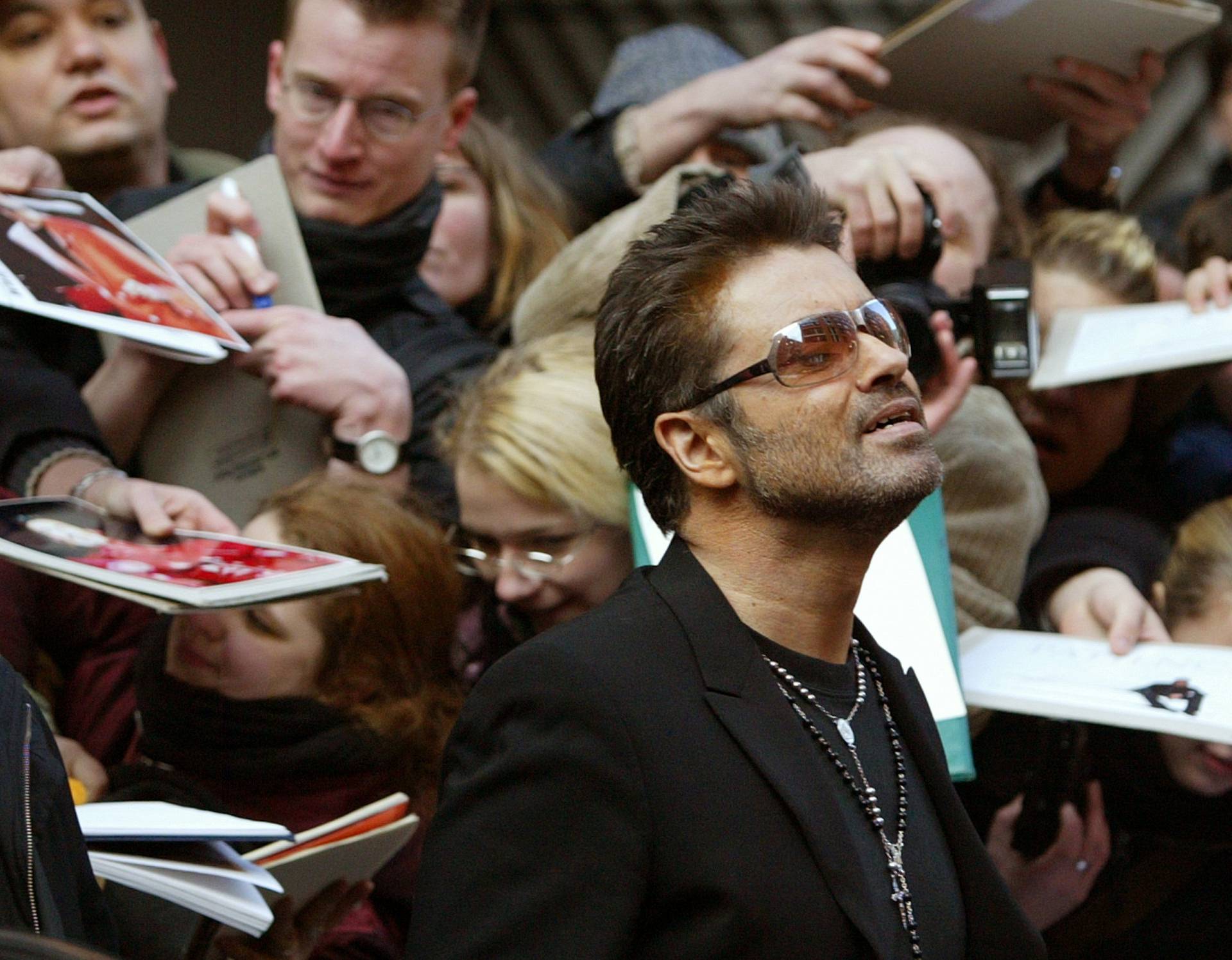 FILE PHOTO British singer and actor George Michael leaves a news conference