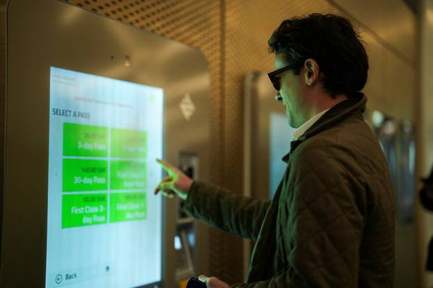 A passenger buys his metro pass at the King Abdullah Financial District Metro Station in Riyadh