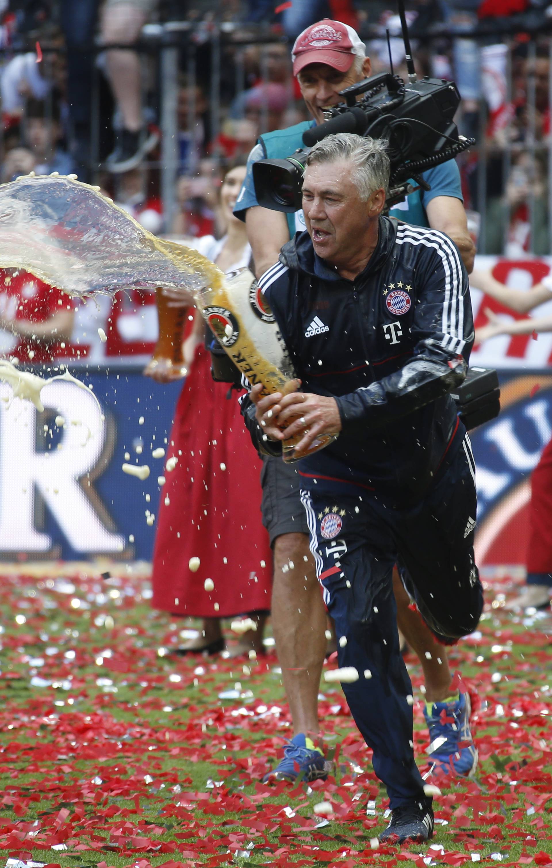 Bayern Munich coach Carlo Ancelotti celebrates after winning the Bundesliga