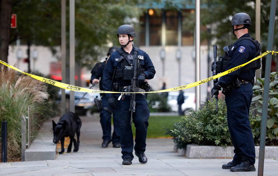 Parents pick up their children from P.S./I.S.-89 school after a shooting incident in New York City