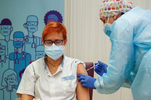 Balafia nursing home worker Sogues Sole receives an injection with a dose of the Pfizer-BioNTech COVID-19 vaccine, in Lleida