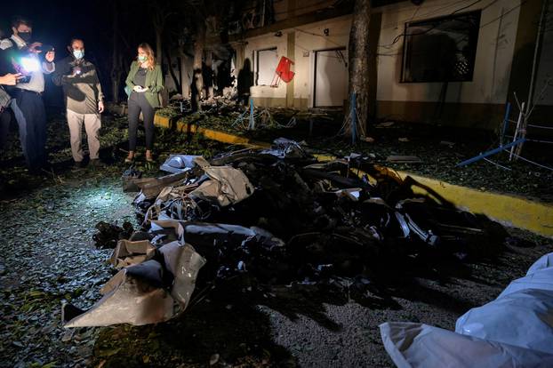The remains of a car bomb that exploded inside a military base are seen in Cucuta
