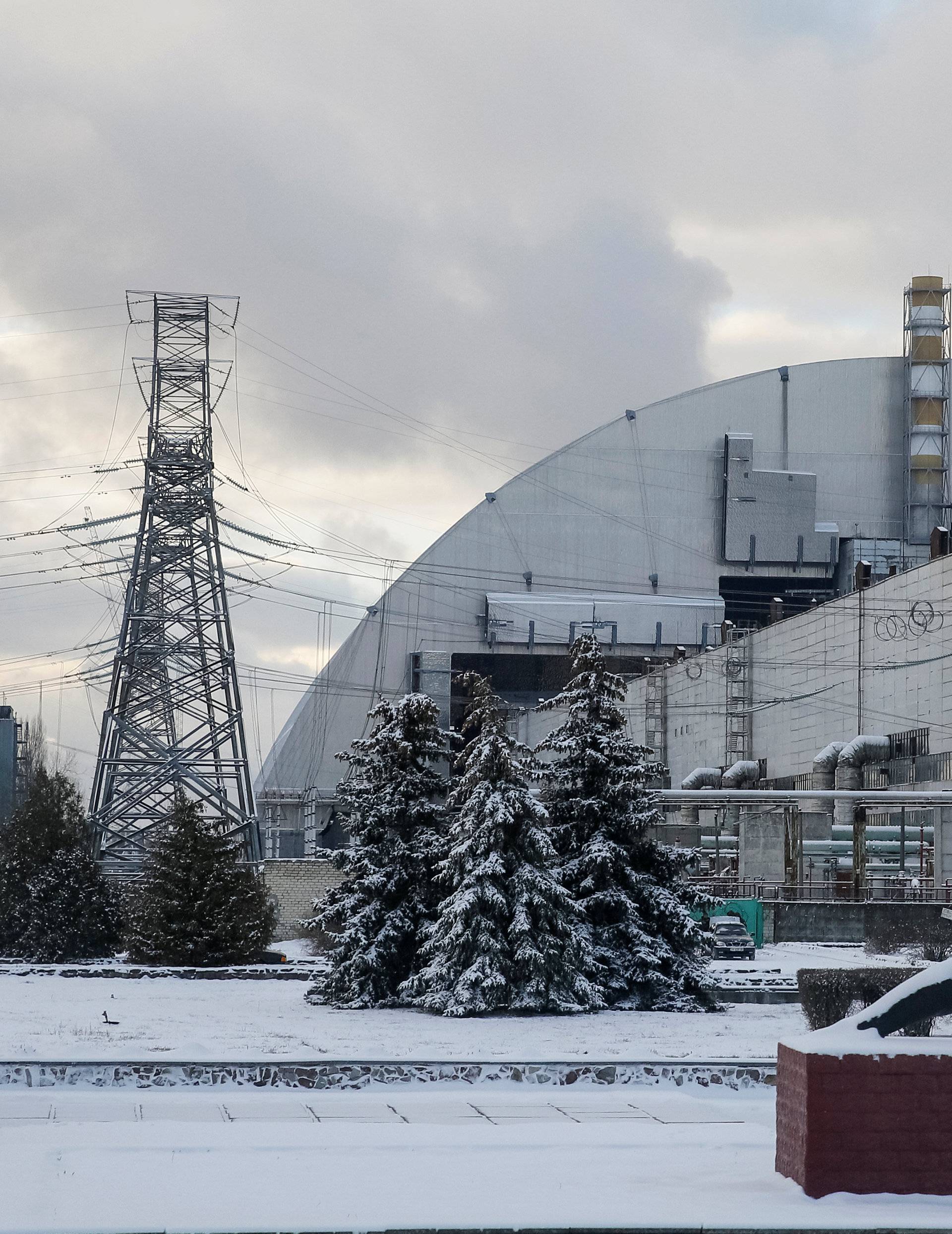 A general view shows a New Safe Confinement structure over the old sarcophagus covering the damaged fourth reactor at the Chernobyl nuclear power plant, in Chernobyl