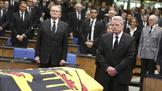 German President Gauck pays last respects during a memorial service for former West German foreign minister Hans-Dietrich Genscher in the former lower house of parliament Bundestag in Bonn